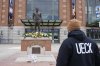 A Milwaukee Brewers fan observes the memorial at the Bob Uecker statue in front of American Family Field prior to a baseball game between the Milwaukee Brewers and the Kansas City Royals on Opening Day Monday, March 31, 2025, in Milwaukee. (AP Photo/Kayla Wolf)
