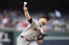 Arizona Diamondbacks starting pitcher Corbin Burnes throws during the first inning of a baseball game against the Washington Nationals, Sunday, April 6, 2025, in Washington. (AP Photo/Nick Wass)