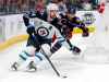 Winnipeg Jets defenseman Josh Morrissey, left, controls the puck in front of Columbus Blue Jackets forward Liam Foudy during the second period of an NHL hockey game in Columbus, Ohio, Thursday, Feb. 16, 2023. (AP Photo/Paul Vernon)