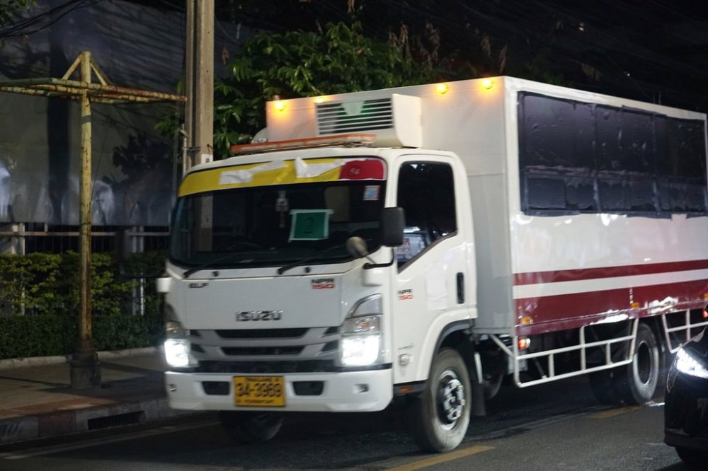 FILE - This photo provided by Thailand's daily web newspaper Prachatai shows a truck with black tape covering the windows leave a detention center in Bangkok, Thailand, on Feb. 27, 2025. (Nuttaphol Meksobhon/Prachatai via AP, File)