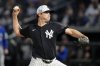 New York Yankees' Gerrit Cole pitches to the Toronto Blue Jays during the first inning of a spring training baseball game Friday, Feb. 28, 2025, in Tampa, Fla. (AP Photo/Chris O'Meara)