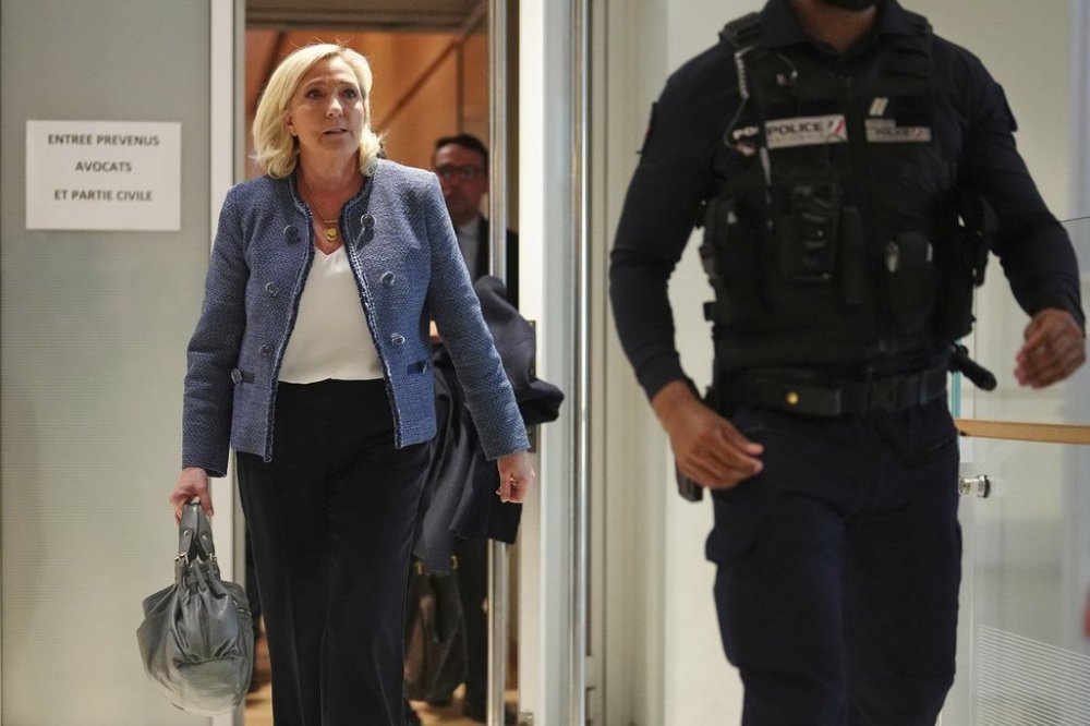 French far-right leader Marine Le Pen leaves the courtroom after a French court found Marine Le Pen guilty on in an embezzlement case but didn't immediately say what her sentence might be and how it might impact the far-right leader's political future, Monday, March 31, 2025 in Paris. (AP Photo/Thibault Camus)