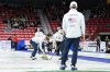 American second Andrew Stopera and vice Tom Howell sweep in front of skip Korey Dropkin before a small crowd at the BKT World Men's Curling Championship in Moose Jaw, Sask., on Sunday, March 30, 2025. THE CANADIAN PRESS/Chris Young