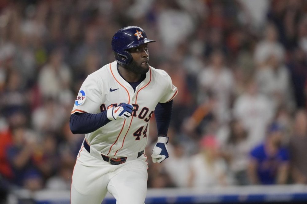 Houston Astros' Yordan Alvarez watches his RBI double against the New York Mets during the sixth inning of a baseball game Saturday, March 29, 2025, in Houston. (AP Photo/David J. Phillip)