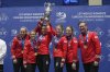 Canada's skip Rachel Homan, Tracy Fleury, Emma Miskew, Sarah Wilkes, Rachel Brown and coach Viktor Kjell, from left to right, pose for the photographers after winning the gold medal match against Switzerland at the World Women's Curling Championship in Uijeongbu, South Korea, Sunday, March 23, 2025. (AP Photo/Lee Jin-man)