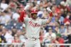 Philadelphia Phillies' Bryce Harper gestures after he singled during the fifth inning of a baseball game against the Washington Nationals, Saturday, March 29, 2025, in Washington. (AP Photo/Nick Wass)