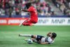 Chicago Fire's Jonathan Bamba, top left, leaps to avoid a tackle as Vancouver Whitecaps' Bjorn Inge Utvik slides and takes the ball away from him during the second half of an MLS soccer match, in Vancouver, on Saturday, March 22, 2025. THE CANADIAN PRESS/Darryl Dyck