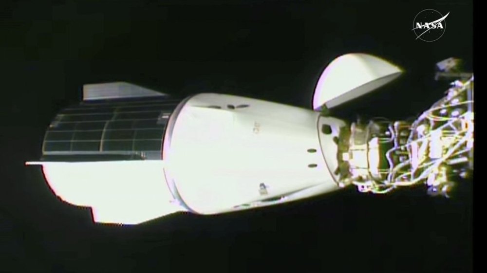 This image made from video by NASA shows the docking of the SpaceX capsule to the International Space Station Sunday, March 16, 2025. (NASA via AP)