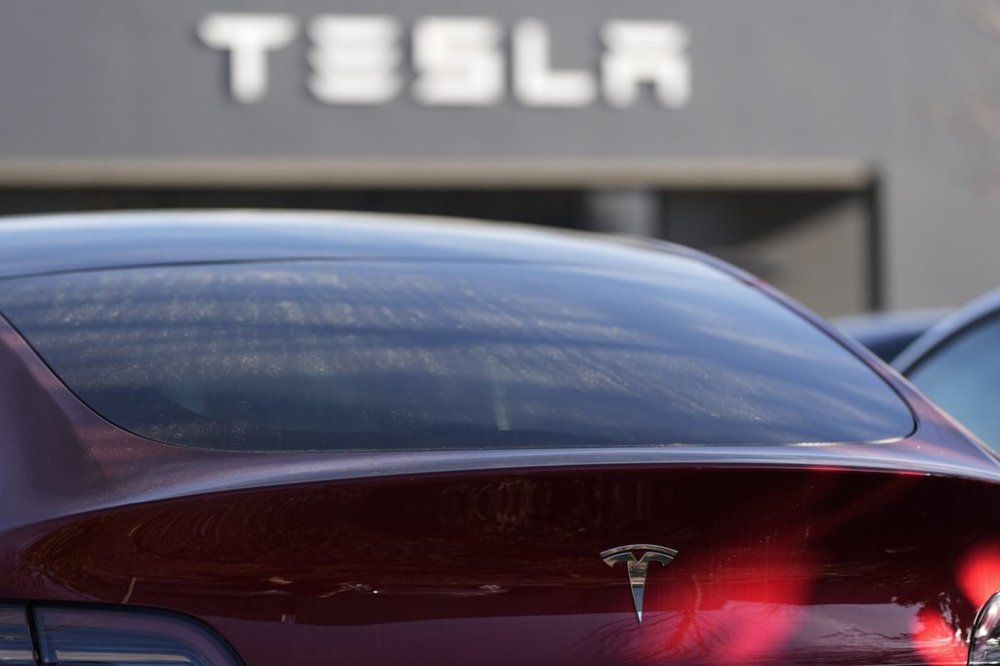 A Tesla model Y and other Telsla vehicles sit at a dealership, Wednesday, March 19, 2025, in Kennesaw, Ga. THE CANADIAN PRESS/AP, Mike Stewart