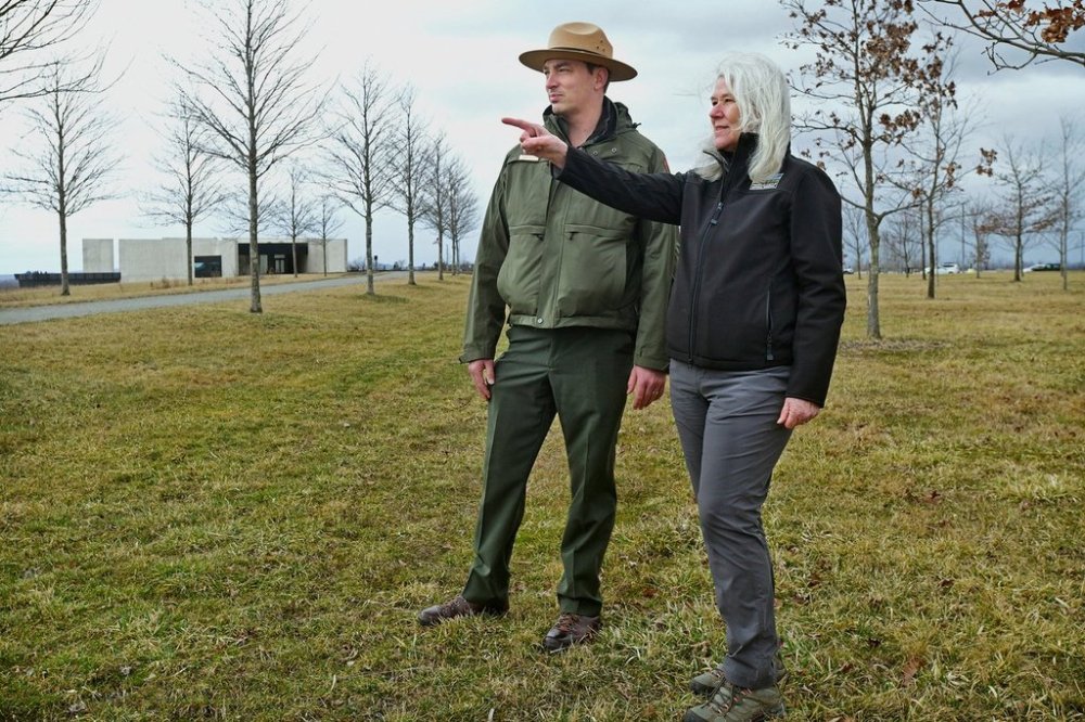 Flight 93 National Memorial Chief of Interpretation and Education Adam Shaffer, left, talks with Friends of Flight 93 National Memorial Executive Director Donna Gibson near the Allée Trail amid the 40 Memorial Groves at the national park near Shanksville, Pa., on Thursday, March 20, 2025. (Thomas Slusser/The Tribune-Democrat via AP)