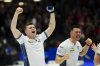Scotland skip Bruce Mouat celebrates his gold-medal win alongside lead Hammy McMillan at the Men's World Curling Championship in Ottawa on Sunday, April 9, 2023. Scotland defeated Canada 9-3. THE CANADIAN PRESS/Sean Kilpatrick