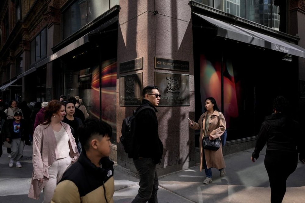 People walk past the Hudson's Bay store in Toronto on March 10, 2025. THE CANADIAN PRESS/Chris Young