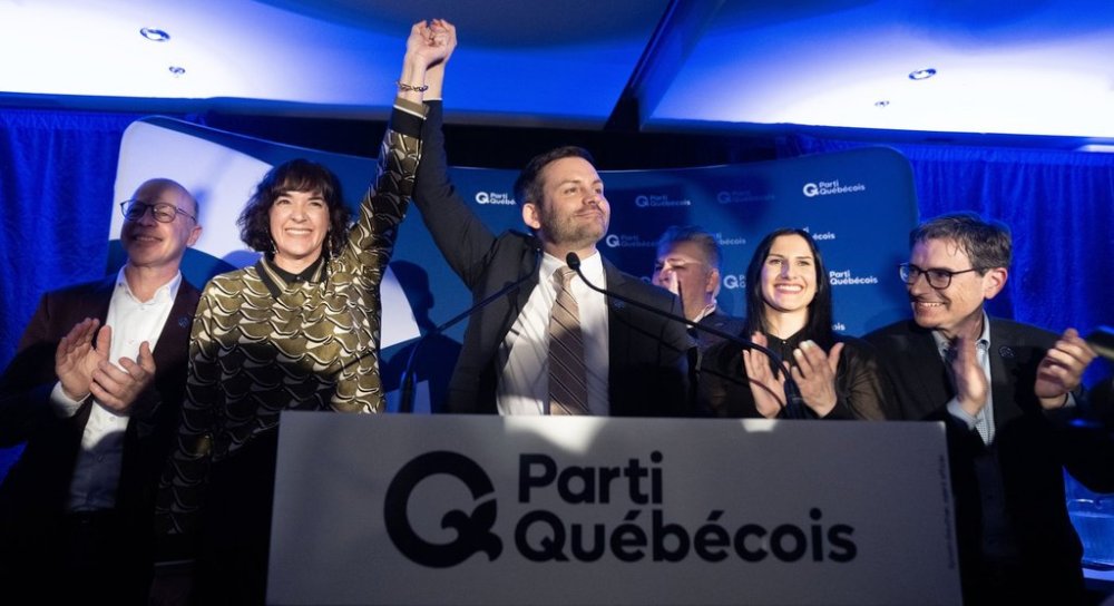 Parti Quebecois (PQ) candidate Catherine Gentilcore, second left, and party leader Paul St-Pierre Plamondon celebrate after winning the byelection in Terrebonne, Que., Monday, March 17, 2025.   THE CANADIAN PRESS/Christinne Muschi