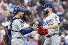 Los Angeles Dodgers catcher Austin Barnes, left, and closing pitcher Tanner Scott, right, celebrate after their team defeated the Philadelphia Phillies in a baseball game, Saturday, April 5, 2025, in Philadelphia. (AP Photo/Laurence Kesterson)