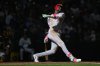 Cincinnati Reds' Elly De La Cruz strikes out swinging during the eighth inning of a baseball game against the Milwaukee Brewers, Sunday, April 6, 2025, in Milwaukee. (AP Photo/Aaron Gash)