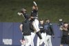 Miami Marlins' Dane Myers, right, celebrates with Derek Hill, left, after hitting a sacrifice fly ball to score Otto Lopez in the twelfth inning of a baseball game against the Pittsburgh Pirates, Saturday, March 29, 2025, in Miami. (AP Photo/Lynne Sladky)
