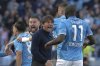 Napoli's head coach Antonio Conte, center, celebrates after Giacomo Raspadori, left, scores during the Serie A soccer match between Napoli and Fiorentina at the Diego Armando Maradona Stadium in Naples, Italy, Sunday March 9, 2025. (Alessandro Garofalo/LaPresse via AP)