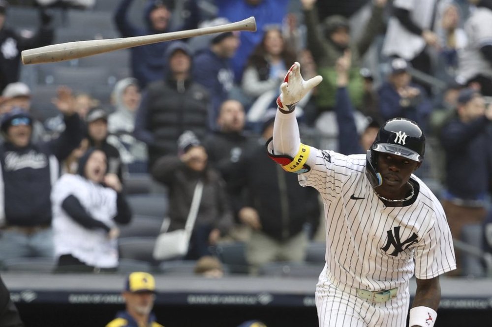 New York Yankees' Jazz Chisholm Jr. reacts after hitting a three-run home run, also scoring Paul Goldschmidt and Aaron Judge, during the seventh inning of a baseball game against the Milwaukee Brewers, Sunday, March 30, 2025, in New York. (AP Photo/Pamela Smith)