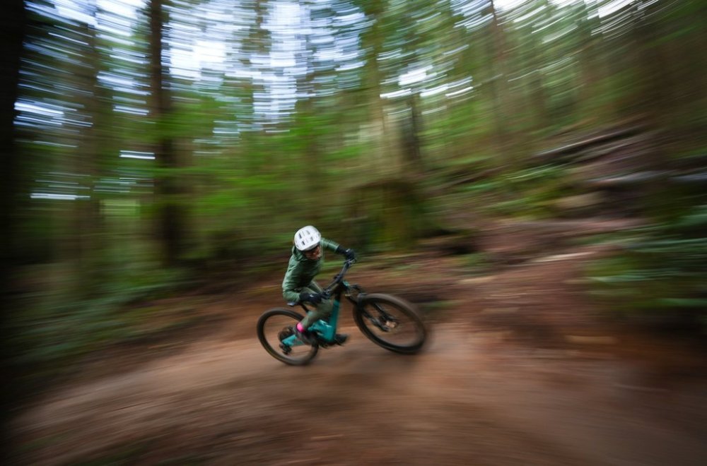 The outdoors were a refuge for many during the pandemic as people hit their local trail networks to mountain bike, hike, run and walk, but advocates in British Columbia say the value of trails isn't reflected in the level of support they receive. Betty Birrell, 76, rides her mountain bike on a trail while posing for a photograph, in North Vancouver, B.C., on December 9, 2024. THE CANADIAN PRESS/Darryl Dyck