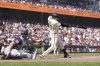 San Francisco Giants' Wilmer Flores, right, hits the the winning RBI single against the Seattle Mariners during the ninth inning of a baseball game in San Francisco, Sunday, April 6, 2025. (AP Photo/Kavin Mistry)