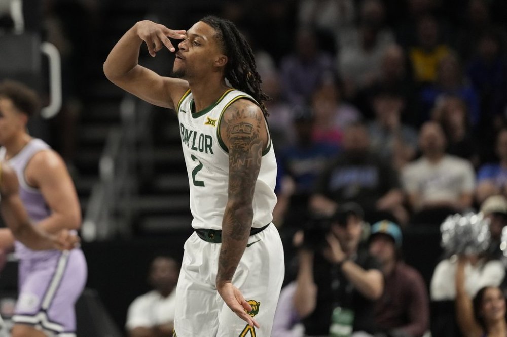 Baylor's Jayden Nunn (2) celebrates during the first half of an NCAA college basketball game against Kansas State in the second round of the Big 12 Conference tournament, Wednesday, March 12, 2025, in Kansas City, Mo. (AP Photo/Charlie Riedel)