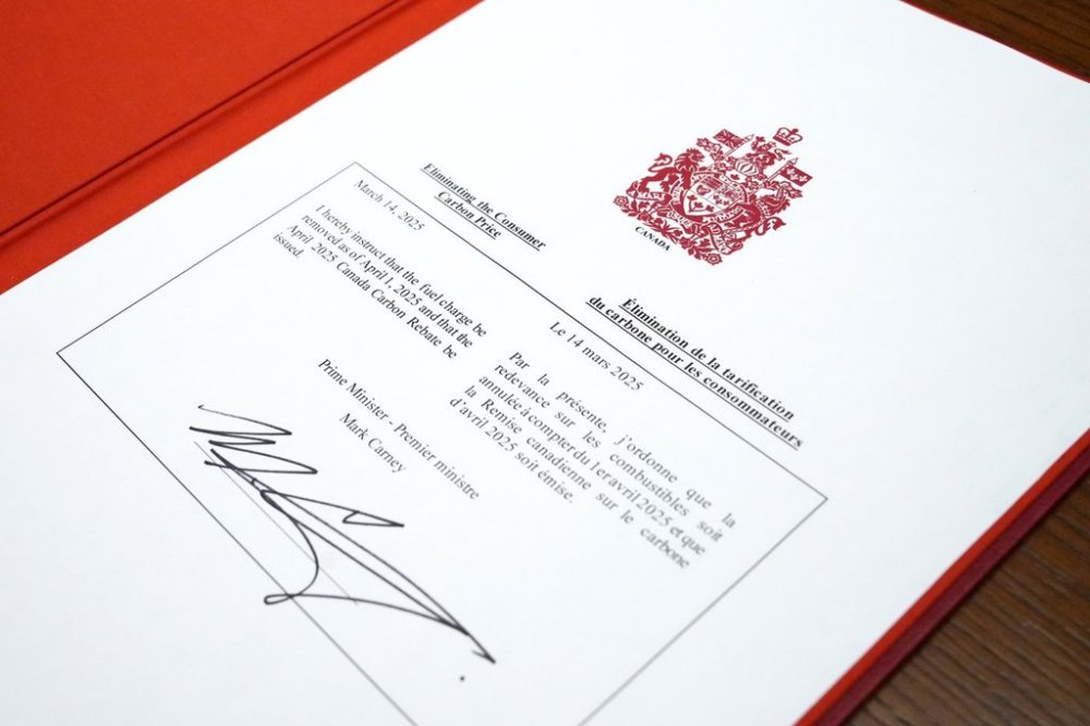 An order-in-council to eliminate the consumer carbon price, signed by Prime Minister Mark Carney, is shown on Parliament Hill in Ottawa on Friday, March 14, 2025. THE CANADIAN PRESS/Justin Tang