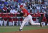 Los Angeles Angels' Ryan Johnson throws a pitch against the Los Angeles Dodgers during the first inning of a spring training baseball game Monday, March 24, 2025, in Anaheim, Calif. (AP Photo/Kevork Djansezian)