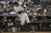 New York Yankees' Aaron Judge (99) hits an RBI double during the sixth inning of the baseball game against the Milwaukee Brewers, Saturday, March 29, 2025, in New York. (AP Photo/Angelina Katsanis)