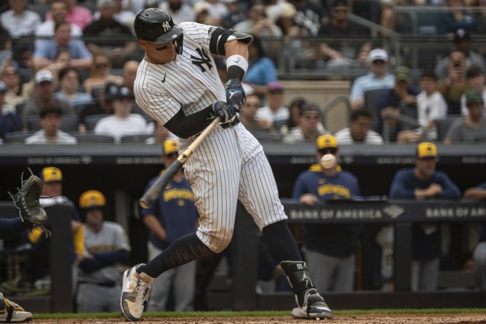New York Yankees' Aaron Judge (99) hits an RBI double during the sixth inning of the baseball game against the Milwaukee Brewers, Saturday, March 29, 2025, in New York. (AP Photo/Angelina Katsanis)