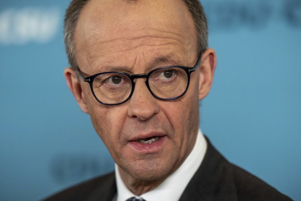 Friedrich Merz, CDU/CSU parliamentary group leader in the Bundestag and CDU federal chairman, makes a statement after the parliamentary group meeting in the Bundestag, Berlin, Friday, March 14, 2025. (Michael Kappeler/dpa via AP)