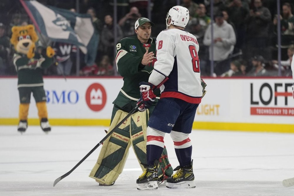 Minnesota Wild goaltender Marc-Andre Fleury (29) and Washington Capitals left wing Alex Ovechkin (8) hug after an NHL hockey game, Thursday, March 27, 2025, in St. Paul, Minn. (AP Photo/Abbie Parr)
