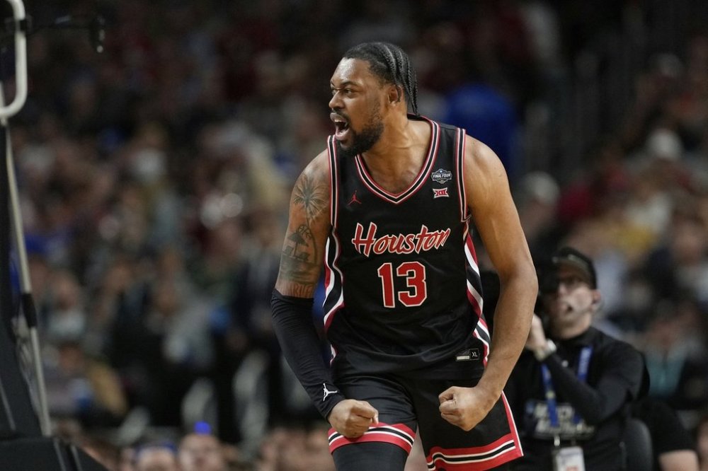 Houston's J'Wan Roberts (13) reacts during the first half in the national semifinals at the Final Four of the NCAA college basketball tournament, Saturday, April 5, 2025, in San Antonio. (AP Photo/Eric Gay)