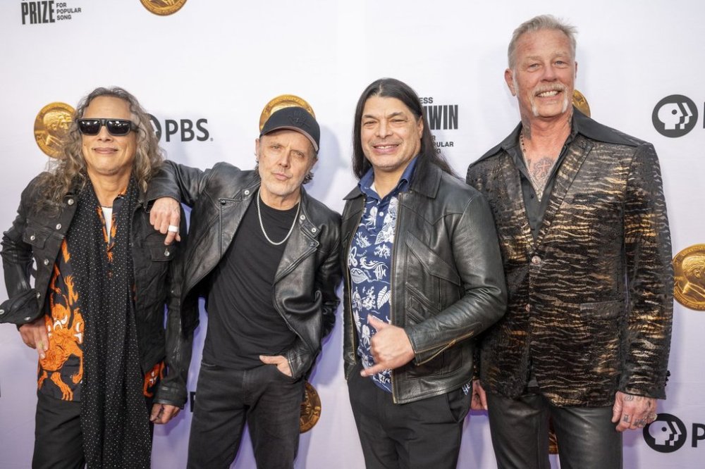FILE - From left, members of Metallica, Kirk Hammett, Lars Ulrich, Robert Trujillo, and James Hetfield arrive on the red carpet at DAR Constitution Hall on March 20, 2024, in Washington. (AP Photo/Kevin Wolf, file)
