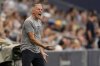 FILE - Sporting Kansas City manager Peter Vermes talks to his players during the first half of an MLS soccer match against the Vancouver Whitecaps Saturday, July 1, 2023, in Kansas City, Kan. (AP Photo/Charlie Riedel, File)
