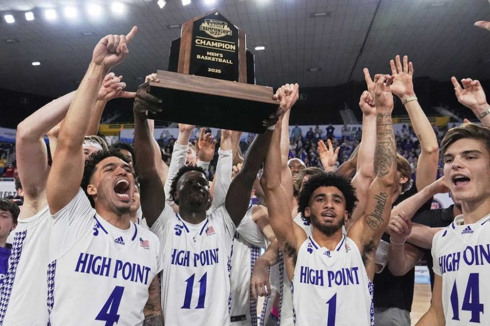 High Point players celebrate after winning the Big South Championship NCAA college basketball game against Winthrop, Sunday, March 9, 2025, in Johnson City, Tenn. (AP Photo/George Walker IV)
