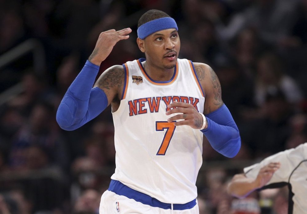FILE - New York Knicks' Carmelo Anthony reacts after hitting a three-point shot during the first half of the NBA basketball game against the Sacramento Kings, Sunday, Dec. 4, 2016 in New York. (AP Photo/Seth Wenig, File)