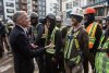 Prime Minister Mark Carney meets with workers after announcing funding for houses during a visit to Edmonton on Thursday, March 20, 2025. THE CANADIAN PRESS/Jason Franson