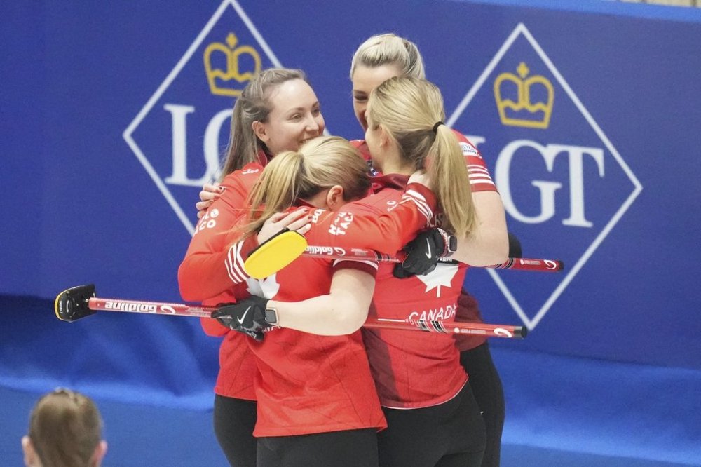 Canada's skip Rachel Homan, left, celebrates with teammates after winning the semifinal match against South Korea at the World Women's Curling Championship in Uijeongbu, South Korea, Saturday, March 22, 2025. (AP Photo/Lee Jin-man)