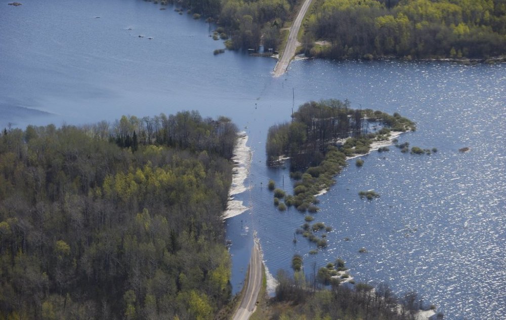 High water levels are washing out highway 307 and leading to several hundred residents being evacuated from the area just northeast of Winnipeg, Tuesday, May 24, 2022. THE CANADIAN PRESS/John Woods