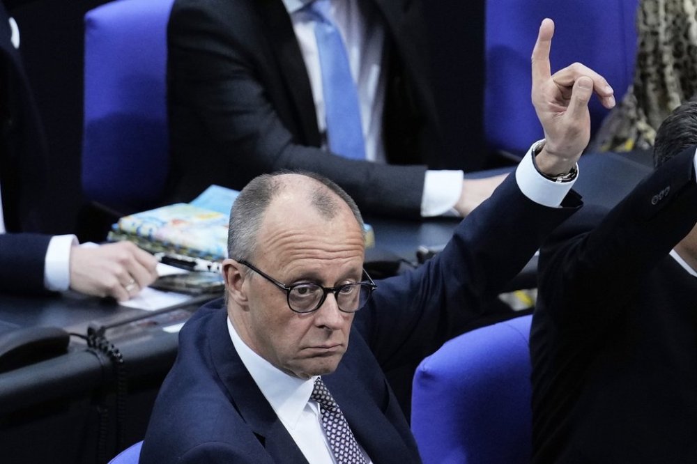 German opposition leader and Christian Democratic Union party chairman Friedrich Merz attends a debate and voting about loosen the country's debt rules and change constitution in the German Parliament Bundestag in Berlin, Germany, Tuesday, March 18, 2025. (AP Photo/Ebrahim Noroozi)