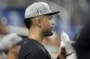 New York Yankees' Giancarlo Stanton looks out from the dugout during an exhibition baseball game against the Miami Marlins, Tuesday, March 25, 2025, in Miami. (AP Photo/Lynne Sladky)