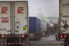 Trucks wait to cross the United States border on the Peace Bridge, Thursday, Feb. 27, 2025. (AP Photo/Lauren Petracca)