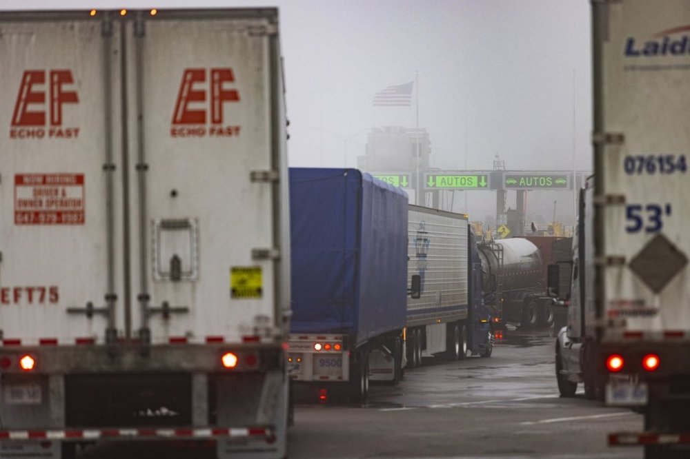 Trucks wait to cross the United States border on the Peace Bridge, Thursday, Feb. 27, 2025. (AP Photo/Lauren Petracca)