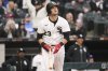 Chicago White Sox's Andrew Benintendi watches his three-run home run during the eighth inning of an opening-day baseball game against the Los Angeles in Chicago, Thursday, March 27, 2025. (AP Photo/Nam Y. Huh)