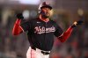 Washington Nationals' James Wood celebrates after his two-run home run as he rounds the bases during the seventh inning of a baseball game against the Los Angeles Dodgers, Monday, April 7, 2025, in Washington. (AP Photo/Nick Wass)