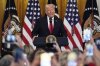 FILE - President Donald Trump speaks at a reception celebrating Women's History Month in the East Room of the White House, Wednesday, March 26, 2025, in Washington. (AP Photo/Mark Schiefelbein, File)