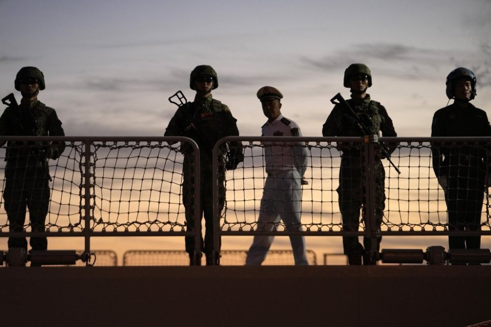 Chinese navy troops attending a joint naval drill with Iran and Russia stand on the deck of their warship in an official arrival ceremony at Shahid Beheshti port in Chabahar in the Gulf of Oman, Iran, Tuesday, March 11, 2025. (AP Photo/Vahid Salemi)