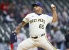 Milwaukee Brewers starting pitcher Néstor Cortes (65) throws to the Cincinnati Reds during the first inning of a baseball game, Thursday, April 3, 2025, in Milwaukee. (AP Photo/Jeffrey Phelps)