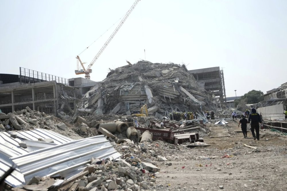 Rescuers work at the site of a high-rise building under construction that collapsed after a 7.7 magnitude earthquake in Bangkok, Thailand, Friday, March 28, 2025. (AP Photo/Sakchai Lalit)
