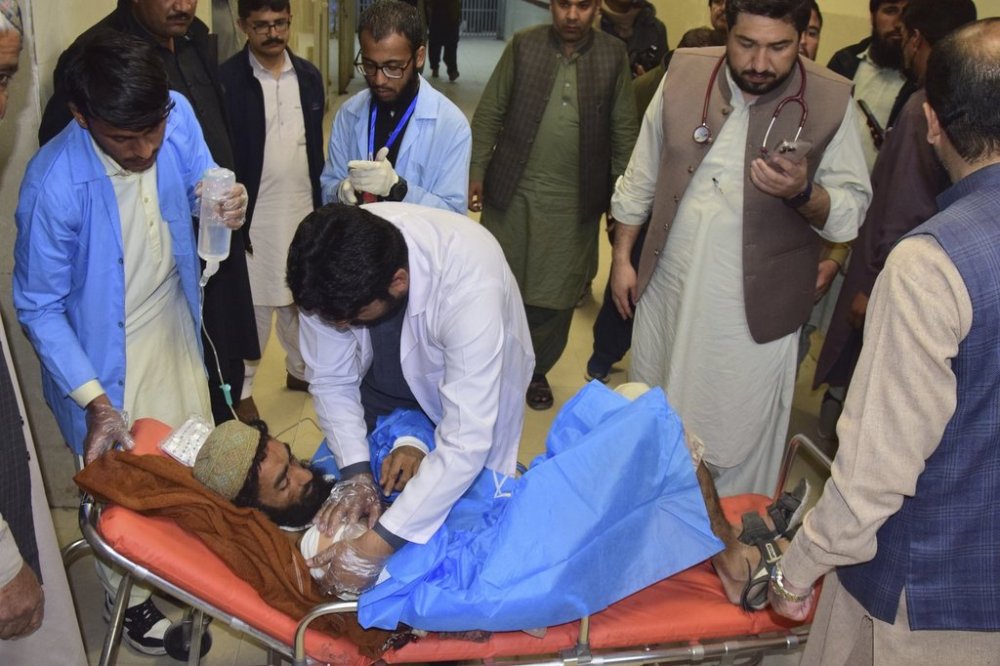 An injured victim of a passenger train attacked by insurgents, receives treatment upon arrival at a hospital in Quetta, Pakistan's southwestern Balochistan province, Thursday March 13, 2025. (AP Photo/Arshad Butt)
